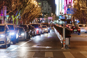 Fototapeta premium Cars at night in capital city