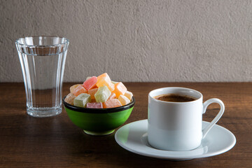 Traditional Turkish delight and Turkish coffee on a wooden background	