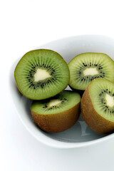 White bowl with kiwis