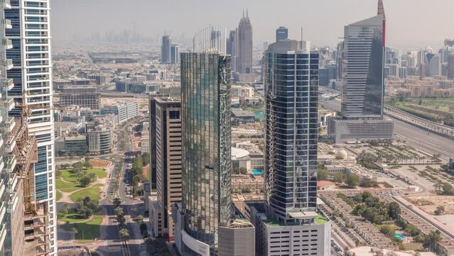 Aerial view of media city and al barsha heights district area all day timelapse from Dubai marina.