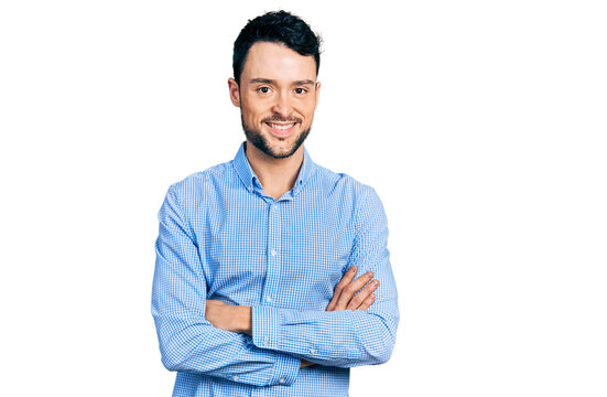 Hispanic man with beard with arms crossed gesture smiling with a happy and cool smile on face. showing teeth.