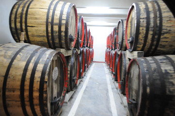 wine cellar. wooden barrels for storing wine. photo inside.