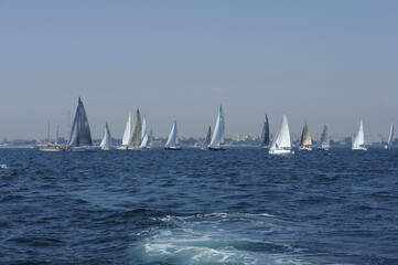 Naklejka premium Seascape with sailboat the background of the blue sky.Beautiful sailboat sailing sail blue Mediterranean sea ocean horizon.