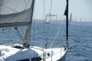 Fototapeta premium Seascape with sailboat the background of the blue sky.Beautiful sailboat sailing sail blue Mediterranean sea ocean horizon.