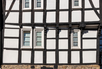 old half-timbered house facade with windows 