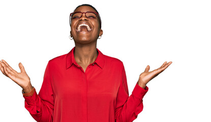 Young african american woman wearing casual clothes and glasses celebrating mad and crazy for...