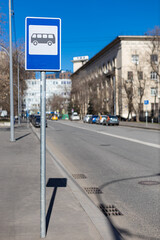  bus stop sign on the side of the road