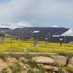 Station with rotating solar panels in a field in Spain. Solar power panels converting sunlight into electricity. Renewable energy for ecological transition