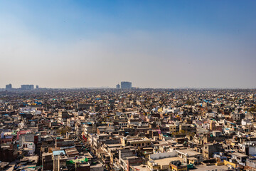 crowded city construction with flat hazy sky at morning from unique angle