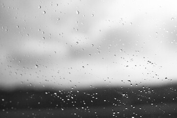 Obraz premium Raindrops on window glass with blur background