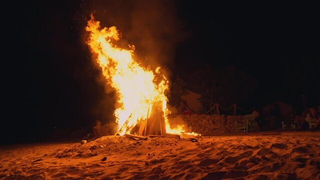 Blazing Fogata En La Palaya On The  Sand Shore (Bonfire On The Beach) During The Night- Static