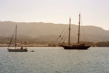 View of the embankment and yachts of the island of Paros (Greece) in a spring evening