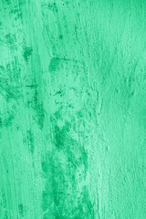 Background, texture of painted concrete dirty in spots, cracked wall in green, turquoise color. Photo after renovation, concept.