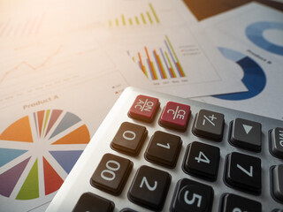 Focus on a calculator that calculates money or expenses. on the graph background