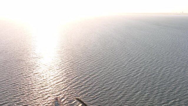 Aerial view of the Paard van Marken at sunrise traditional historic landmark monument light house on the shore of the island of Marken in The Netherlands.