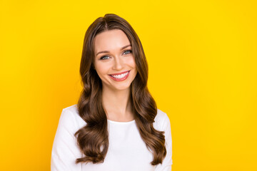 Photo of adorable sweet woman wear white shirt smiling empty space isolated yellow color background