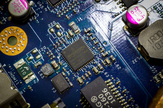 Sochi, Russia - April 4 2022: Broadcom brand name on chip on pc  motherboard. Semiconductor industry giants.