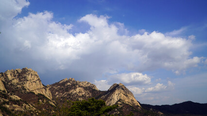 The day after the rain, the rocky mountains and white clouds.