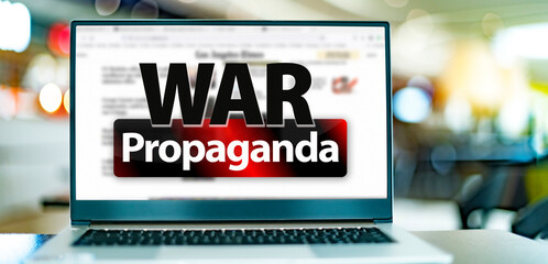 Laptop computer displaying the sign of 'WAR Propagada'