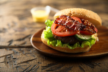 Homemade burger with fried bacon