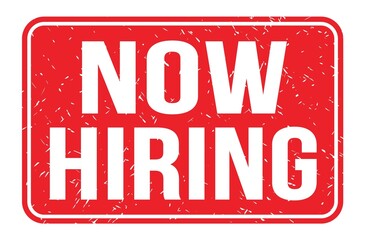 NOW HIRING, words on red rectangle stamp sign