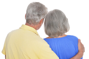 Rear view of senior couple hugging on white background