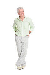 Full length portrait of senior man posing on white background