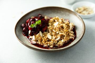 Healthy oatmeal porridge with cherries and almond