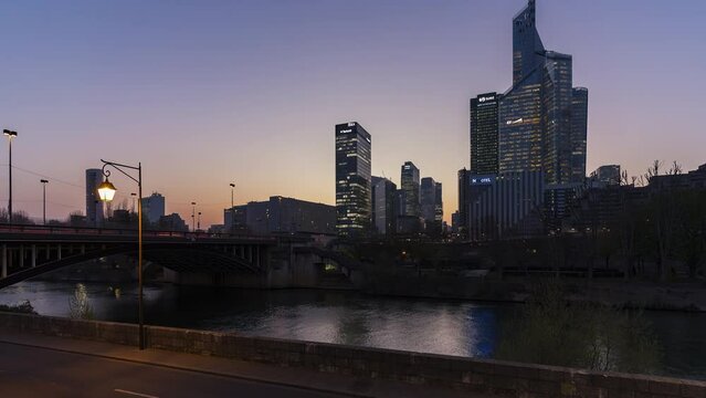 Paris, France, Timelapse - The skyline of the financial district of Paris from day to night as seen from Neuilly sur Seine