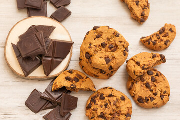 Chocolate cookies on white wooden table. Chocolate chip cookies shot