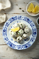 Traditional homemade meatballs with cream, capers and lemon