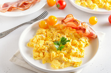 Scrambled eggs on white plate