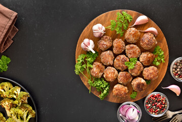 Roasted meatballs on cutting board