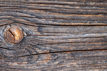 Altes Holzbrett mit Astloch als Hintergrund oder Textur