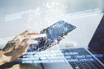 Double exposure of creative code skull hologram and finger clicks on a digital tablet on background. Malware and cyber crime concept