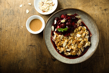 Obraz na płótnie Canvas Healthy oatmeal porridge with cherries and almond