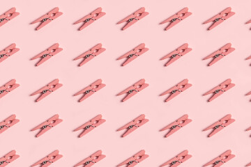 Pink clothespin pattern on a pastel pink background