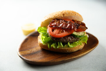 Homemade burger with fried bacon