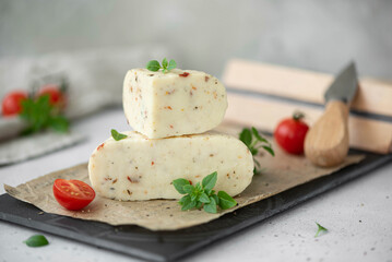 soft homemade cheese with tomatoes and basil
