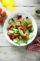 Healthy green salad with tomato and cucumber