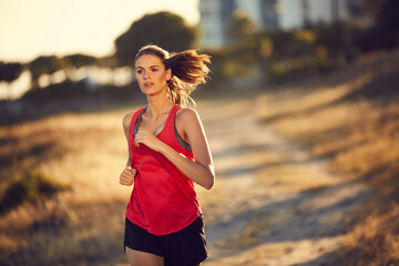 Make your heart happy. Shot of a sporty young woman exercising outdoors.