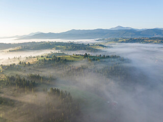 Morning fog in the Ukrainian Carpathians. Aerial drone view.