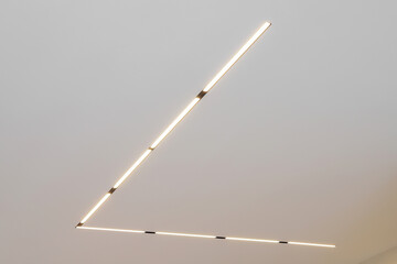 Modern LED lamp on the ceiling in the interior