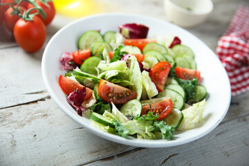 Healthy green salad with tomato and cucumber
