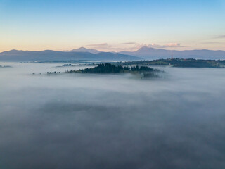 Morning fog in the Ukrainian Carpathians. Aerial drone view.
