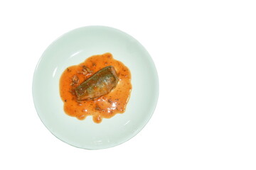 fish can with tomato sauce on plate in white background