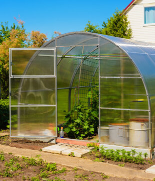 open door of greenhouse from transparent polycarbonate