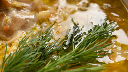 Delicious german soup eintopf with chicken and sauerkraut on the dinner table