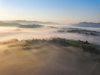Morning fog in the Ukrainian Carpathians. Aerial drone view.