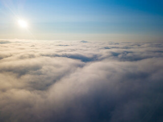 High flight above the clouds. Aerial drone view.